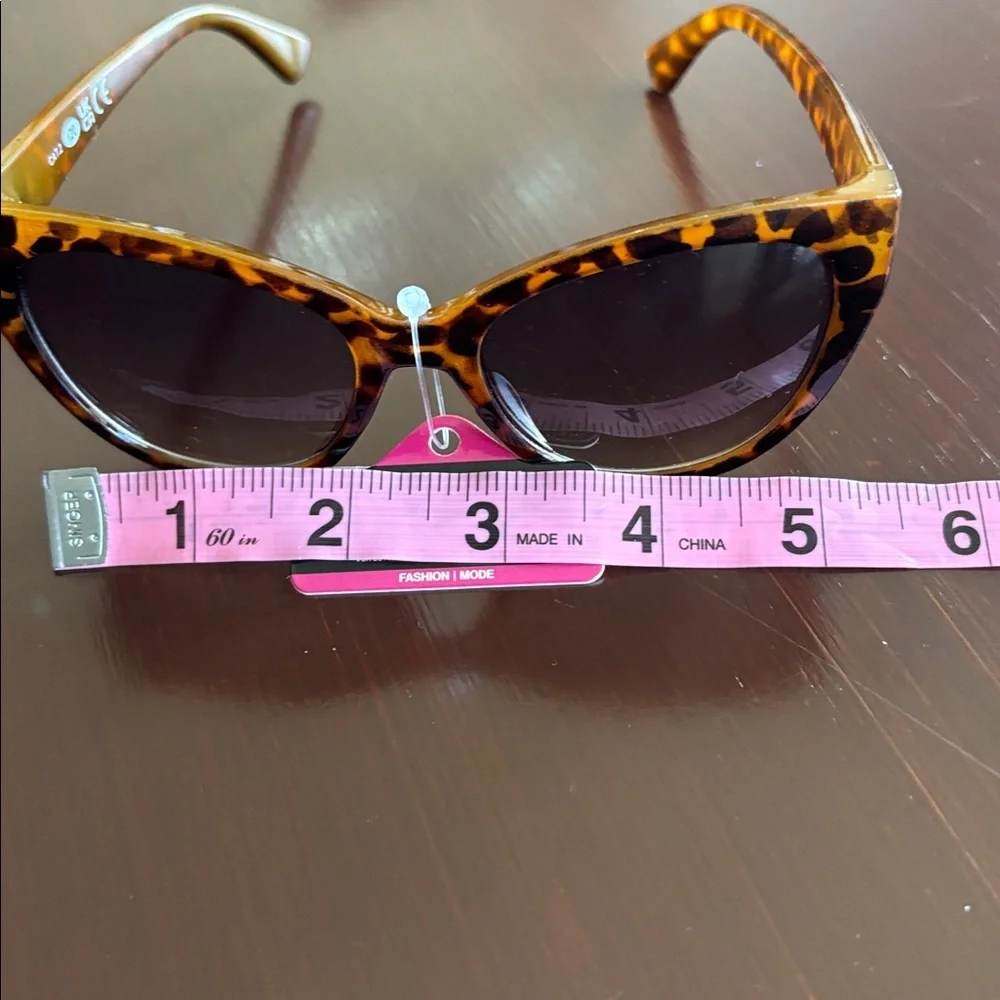 Foster Grant 100% UVA-UVB protection leopard print, gold tone beaded frame edge